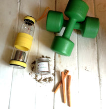 A bottle of Post Workout Tisane and an infuser gym bottle